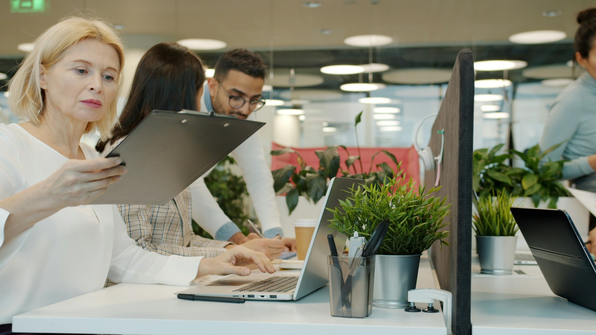 A diverse operations team working with business records